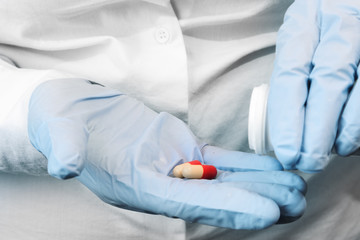Doctor's hands with a drug, closeup. Healthcare concept.