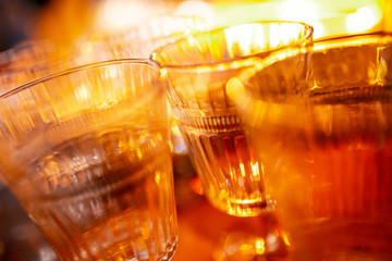 Close-up cut glasses for drinks with soft focus in warm natural light