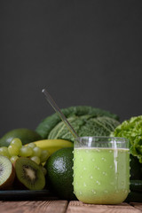 Fruits and vegetables wooden table dark background .