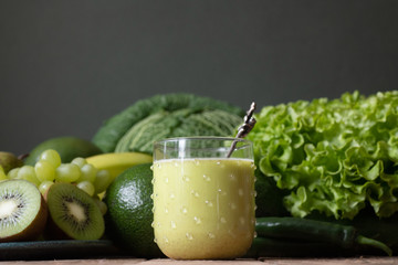 Fruits and vegetables wooden table dark background .