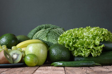 Fruits and vegetables wooden table dark background
