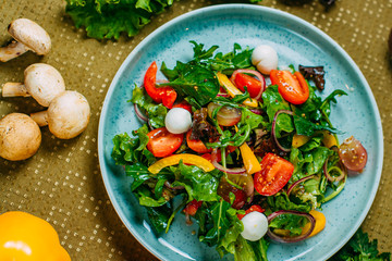 fresh vegetable salad, healthy food on a decorated table