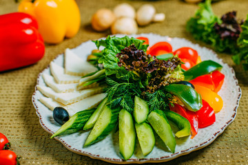 assorted vegetables and cheese, healthy food on a decorated table