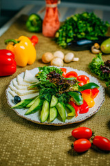assorted vegetables and cheese, healthy food on a decorated table