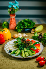 assorted vegetables and cheese, healthy food on a decorated table