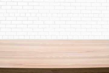 Light Wood Table and White Brick Background