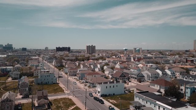 4K. Aerial view of Atlantic city. Atlantic coast. Drone footage of streets, hotels, shopping centers and residential buildings from above.