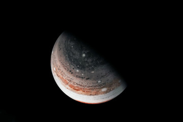 Saturn in unusual colors, on a dark background. Elements of this image were furnished by NASA.