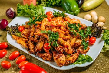 Assorted chicken, a dish for the company, on a decorated table