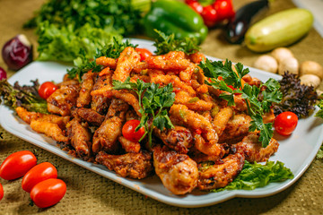 Assorted chicken, a dish for the company, on a decorated table