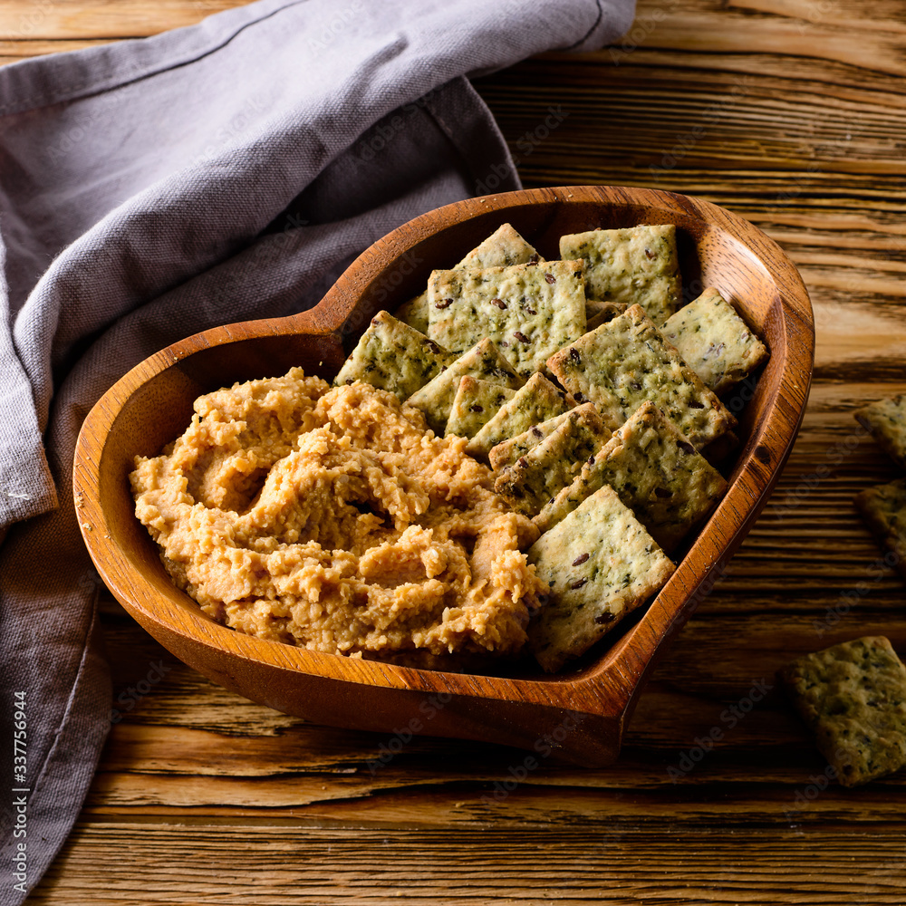 Sticker healthy bread and hummus in a plate heart rustic still