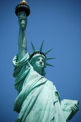 Fototapeta premium The Statue of Liberty against the blue sky