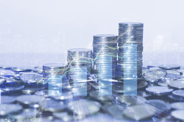 double exposure many coins stack with growth graph and chart and city background. business financial banking and money saving concept.