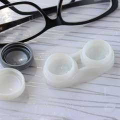 Contact lenses in container, bottle with solution, glasses - 337760504