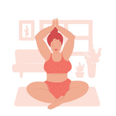 The girl practices yoga at home. Lotus position