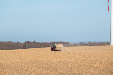 Obraz premium tractor loaded with seed delivers the seed