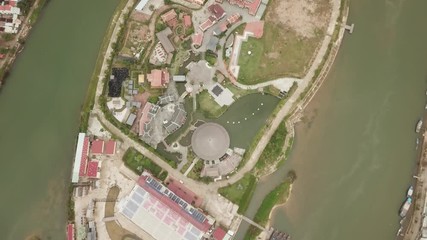 a flying camera is filming Halong Bay. Boats float along the river - Powered by Adobe