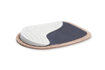 Orthopedic silicone heel pad from corns for the correction of different lengths of legs isolated on white background. Silicone insert for the forefoot. Insole. Silicone thumb protector with interdigit