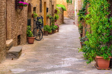 Fototapeta na wymiar View of an alley in the historic district of Colle Val d'Elsa a small town near Siena in Tuscany