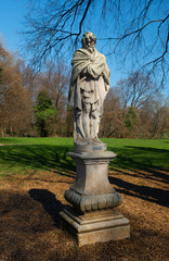 Obraz premium Stone statue at Parco Querini, the largest public park in the city of Vicenza. The work is a representation of winter and was created between 1600 and 1700. The soft stone is affected by pollution.
