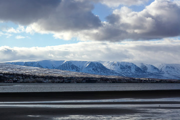 snow-covered majestic mountains near the ocean. The Landscape Of Iceland