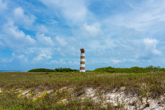 Tropical Island With Its Lighthouse In Cayo De Agua  (Los Roques Archipelago, Venezuela).