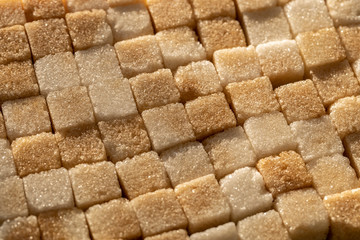 A lot of white brown sugar cubes 