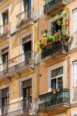 Fototapeta na wymiar Detail of Beautiful Facade Building Architecture In City Of Barcelona, Spain