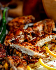 close up of grilled chicken breast filled with mushroom carrot and bell pepper