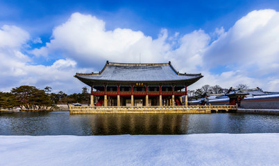 The after snow storm and Gyeonghoeru Pavilion at Gyeongbokgung Palace in Seoul, South Korea. Gyeonghoeru Pavilion on a sign...