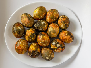 plate with beautiful and colored eggs for Easter