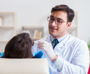 Fototapeta premium Patient visiting dentist for regular check-up and filling