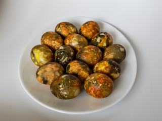 plate with beautiful and colored eggs for Easter