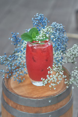 alcoholic cocktail with fruits on an old wooden table