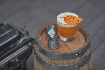 alcoholic cocktail with fruits on an old wooden table