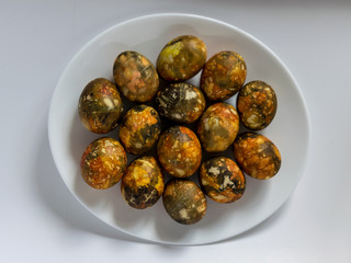 plate with beautiful and colored eggs for Easter
