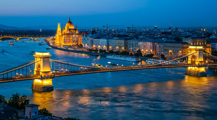 Fototapeta na wymiar Panoramic of Chain Bridge and Parliament in Budapest at dusk