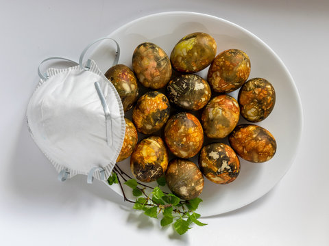 many bright and colorful Easter eggs and face mask