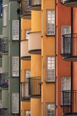 Zelfklevend Fotobehang Green, yellow and orange apartment buildings in Stockholm city. © Anette Andersen