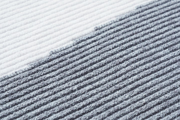 Abstract background and texture gray-white knitted fabric, diagonal stripes...