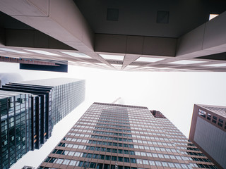 Fototapeta premium deep street canyons of frankfurt am main, germany on a cloudy day