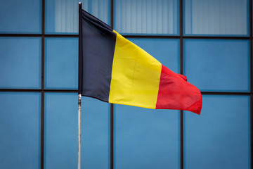 German flag on the background of building glazing