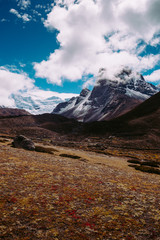 Beautiful mountain peaks and soft white clouds