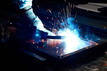 worker welding steel