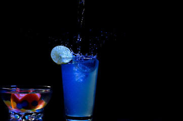 glass, splash, drink, cocktail, water, alcohol, martini, liquid, beverage, blue, cold, bar, ice, isolated, splashing, drop, fresh, party, bubble, pouring, vodka, wet, white, cool, refreshment