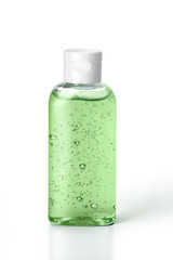 Pocket antiseptic green hand sanitizer gel with aloe vera, isolated on white background, no label. Small bottle of transparent antibacterial liquid, moisturizing. Hydro alcoholic, ethyl alcohol.
