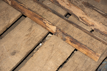 Old raw boards lay on top of each other
