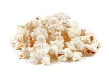 A bunch of fresh popcorn closeup on white. Salty popcorn. Top view.