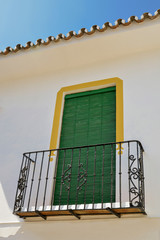 Balcony with green blinds in the Andalusian style