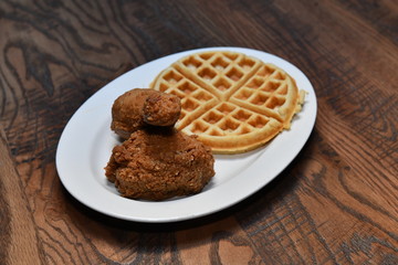 Crispy fried chicken bites with salad. Traditional american food.